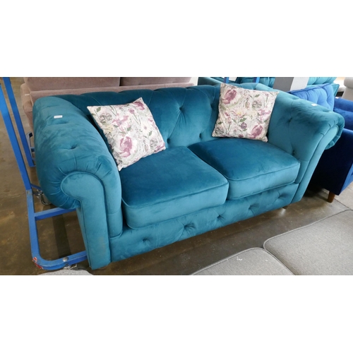 3060 - A turquoise velvet Chesterfield three seater sofa