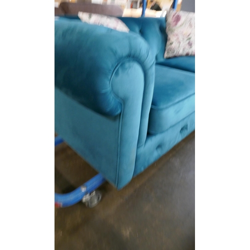 3060 - A turquoise velvet Chesterfield three seater sofa