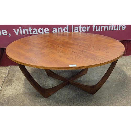 9 - A teak circular coffee table