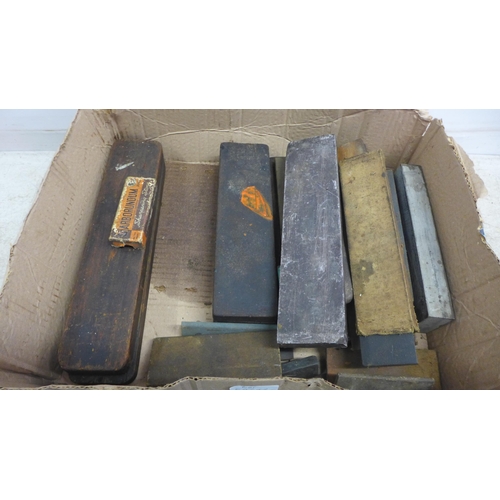 5029A - A box of approximately 30 sharpening stones including oil, whet and natural stones