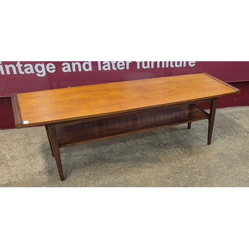 23 - A teak rectangular coffee table