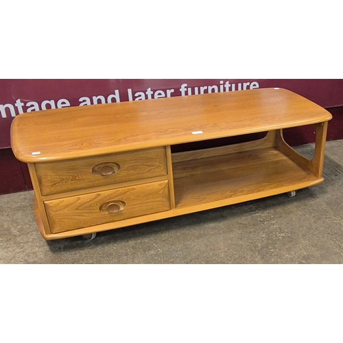 24 - An Ercol Blonde elm Minerva coffee table