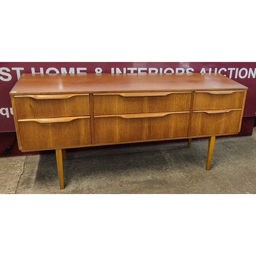 14 - An Austin Suite teak six drawer sideboard