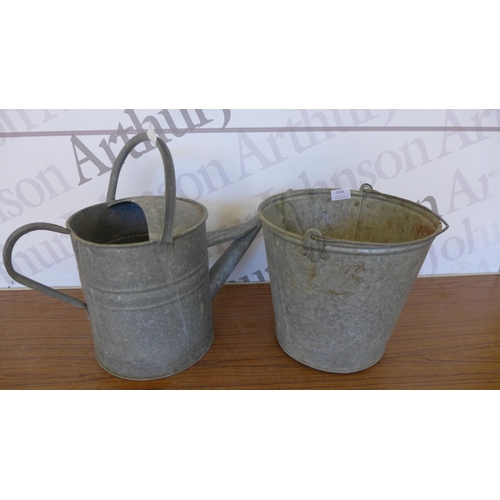 5160 - A galvanised steel watering can and bucket