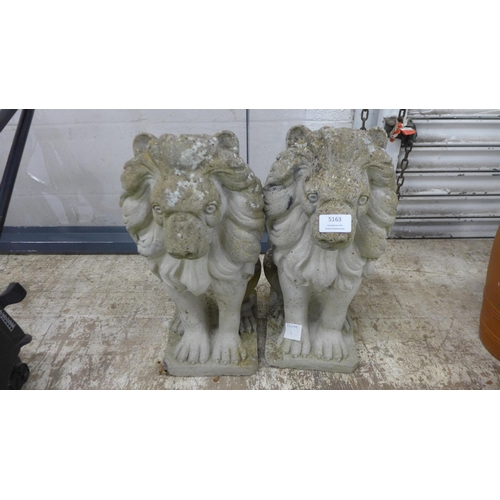 5163 - A pair of concrete stone effect lion garden ornaments