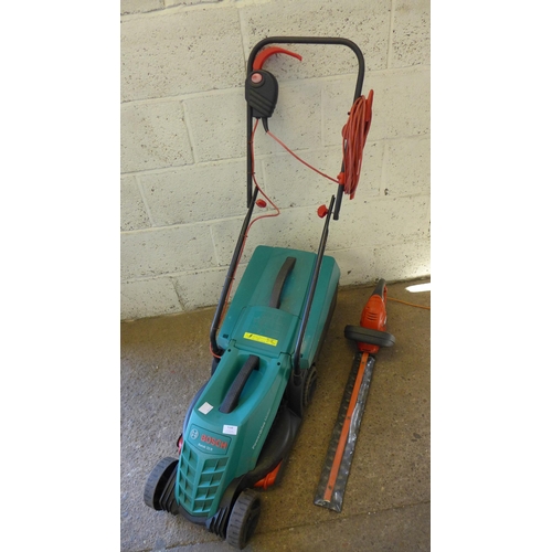 5168 - A Bosch Rotak 32R electric lawnmower with collection box and a Black and Decker GT5050 electric hedg... 