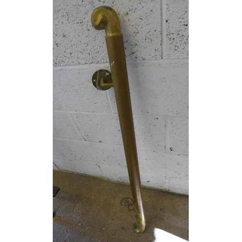 5173 - A brass handrail and a vintage pogo stick