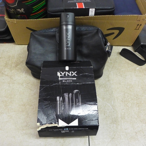 5061 - A box of men's cosmetics including a Lynx Black travel set, a Baylis and Harding wash bag with showe... 