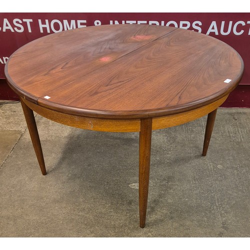 49 - A G-Plan Fresco teak circular extending dining table