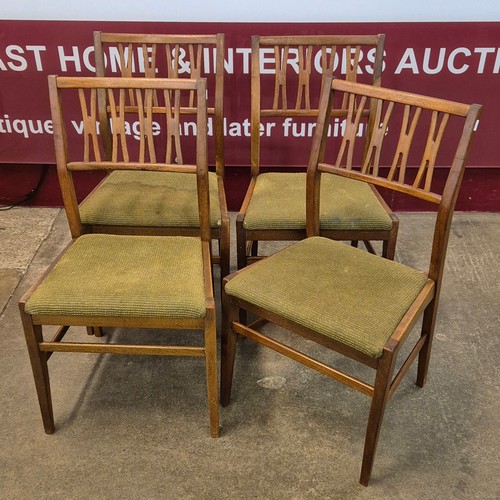 50 - A set of four four teak dining chairs