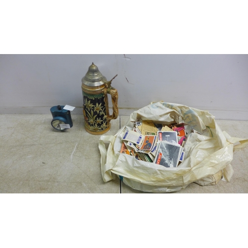 5090 - A collection of assorted collectable cards, a vintage bike light and a beer stein