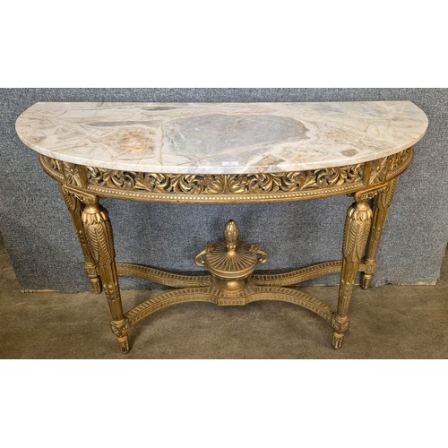 118 - A French Louis XIV style gilt and marble topped demi lune console table