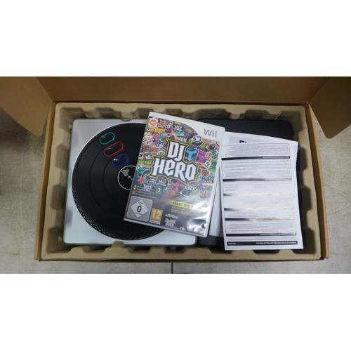 5064 - A quantity of gaming equipment including an XBox 360 with HDD, a Playstation 2, a Nintendo Wii, asso... 