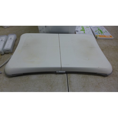 5065 - A Nintendo Wii console with Wii fit balance board, power supply and all connecting cables, sensor ba... 