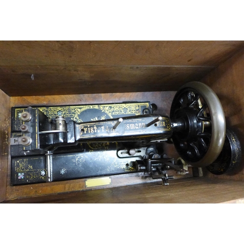 1008 - A Singer sewing machine, c1930s, in an inlaid wooden case, case a/f **PLEASE NOTE THIS LOT IS NOT EL... 