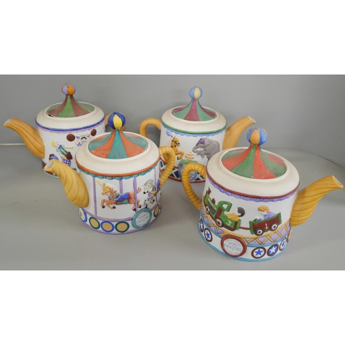 1027 - A 1950s gold lustre tea set, four Christopher Wren Circus tea pots, two resin models of Siberian tig... 