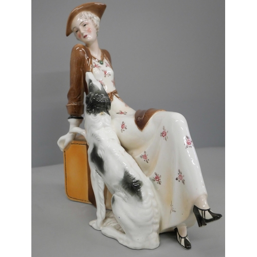 603 - A 1930s Katzhutte porcelain Art Deco figure of a lady with dog