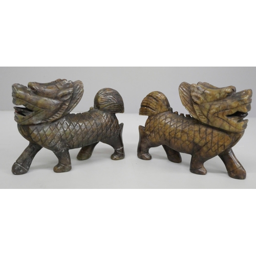 625 - Two carved jade/soapstone figures of foo dogs, each 10.5cm long, one a/f (legs)