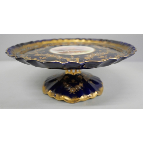 628 - A hand decorated comport, marked 'Manufactured for Henderson China Rooms, Sunderland', circa 1900, t... 