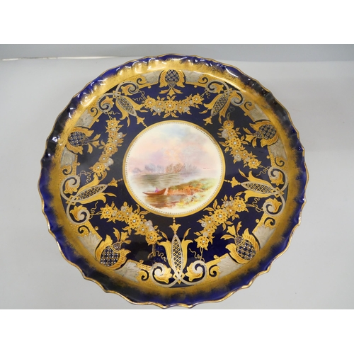 628 - A hand decorated comport, marked 'Manufactured for Henderson China Rooms, Sunderland', circa 1900, t... 