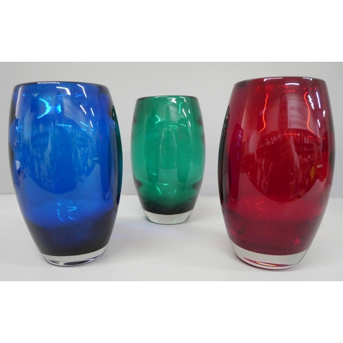 630 - A set of three coloured glass vases, 15cm