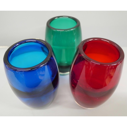 630 - A set of three coloured glass vases, 15cm