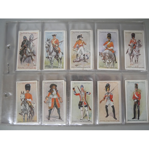 633 - Cigarette cards; three sets - Player's Cats (24), Player's Regimental Uniforms (50) and Player's Dru... 