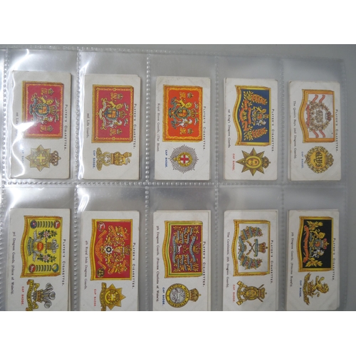 633 - Cigarette cards; three sets - Player's Cats (24), Player's Regimental Uniforms (50) and Player's Dru... 