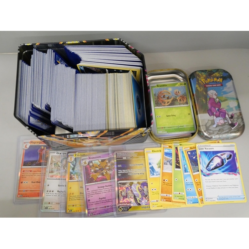 645 - 600 plus Pokémon cards including colour graphic and Black Star rares and tins