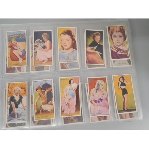 649 - Cigarette cards; an album of cigarette cards containing ten complete sets including Players 'Wrestli... 