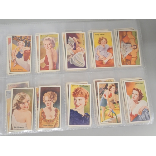 649 - Cigarette cards; an album of cigarette cards containing ten complete sets including Players 'Wrestli... 