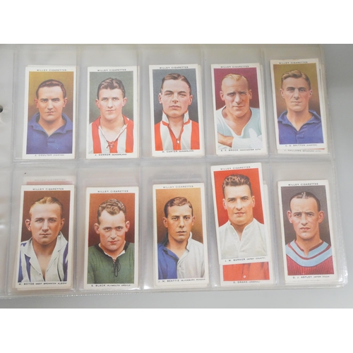 649 - Cigarette cards; an album of cigarette cards containing ten complete sets including Players 'Wrestli... 