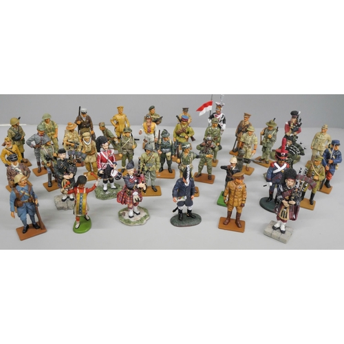 660 - A collection of Sculptures UK resin figures of pipers and a collection of del Prado metal models of ... 