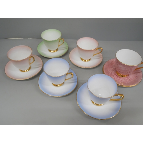 665 - Royal Albert cups and saucers, five of one set, a separate cup and two saucers and a boxed set of De... 