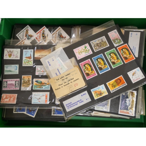 678 - A collection of vintage stamp sets in dealers folders with a display and packs of stamps batched up,... 