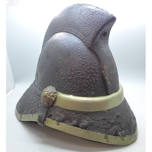 739 - A fireman's helmet, circa 1920s, stamped made in Glasgow, JAS Hendry