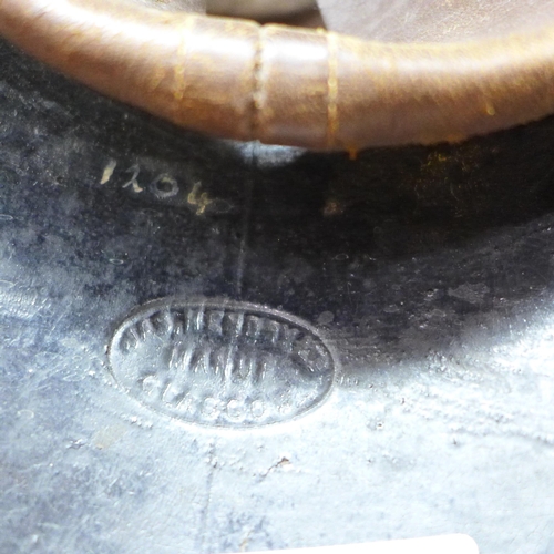 739 - A fireman's helmet, circa 1920s, stamped made in Glasgow, JAS Hendry