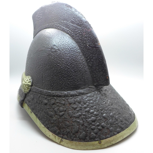 739 - A fireman's helmet, circa 1920s, stamped made in Glasgow, JAS Hendry