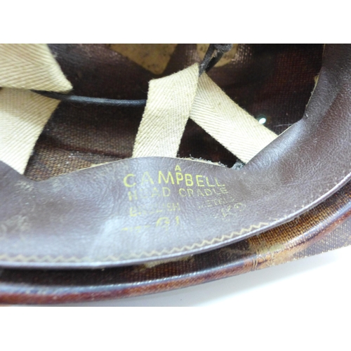 747 - A small child's pit helmet, marked 'A Campbell Head Cradle' and a pair of clogs, marked 1945 and wit... 