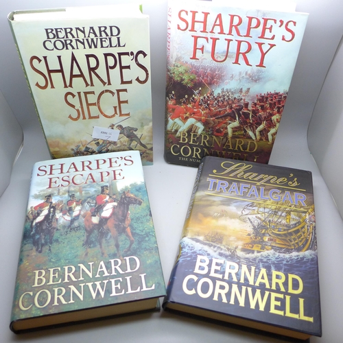 771 - Four hardback first edition books by Bernard Cornwell, Sharpe's Siege, 1987 and the eighth book in t... 