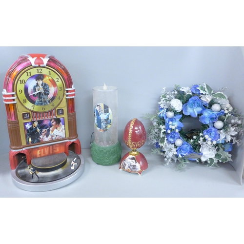 774 - A box of Elvis Presley, Bradford Exchange items, jukebox clock, musical egg and candle with wreath