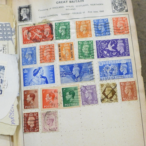 786B - A collection of stamps, postcards and a binder containing international coinage