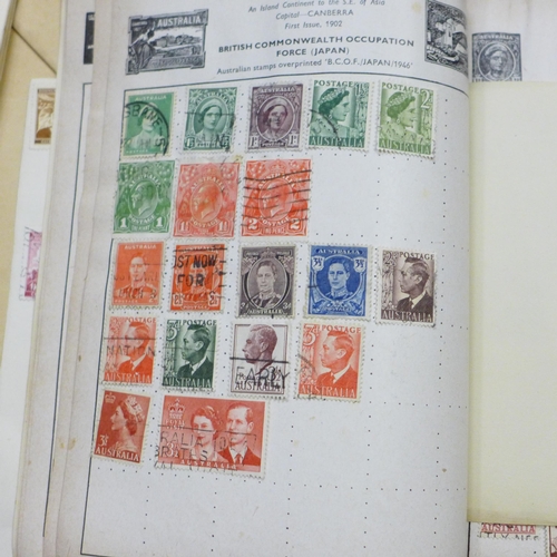 786B - A collection of stamps, postcards and a binder containing international coinage