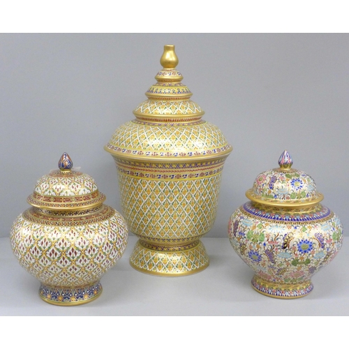 793 - Two Thai Benjayong lidded vases and one other larger lidded vase, 31cm with colourful enameled detai... 