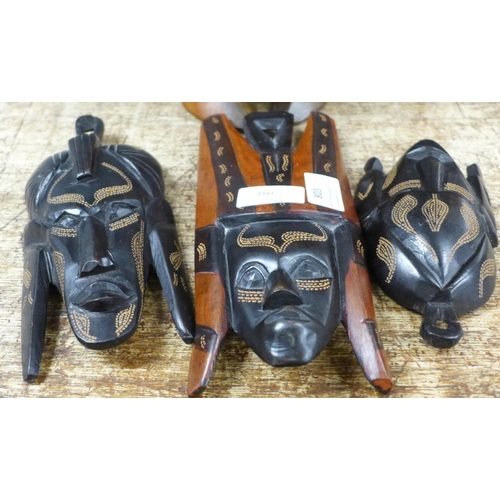 803 - Tourist tribal hardwood carvings; three warrior heads marked Jambo, Kenya 1993, a female figure, 36c... 