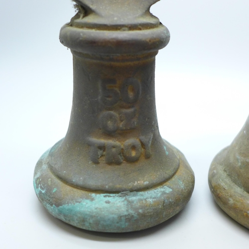 806 - Two vintage brass weights, 50 and 100 troy oz