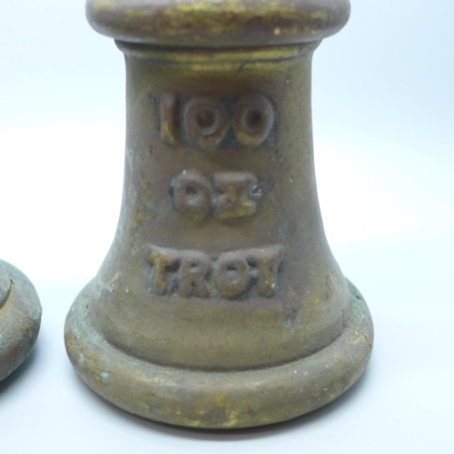 806 - Two vintage brass weights, 50 and 100 troy oz