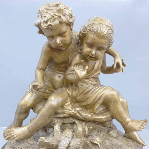 811 - A figure group, sculpture of two putti, 36cm