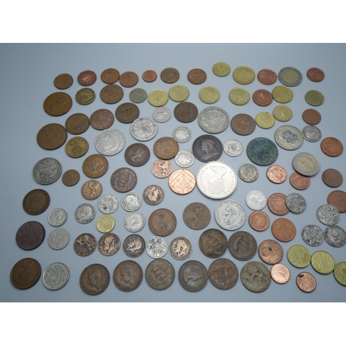 856 - A collection of coins, British and foreign, 62g of 1920 to 1946 half silver coins