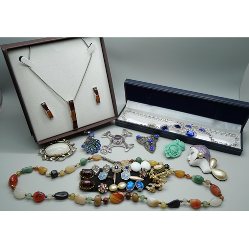 859 - A collection of jewellery including a silver and amber set pendant with matching earrings, crystal n... 